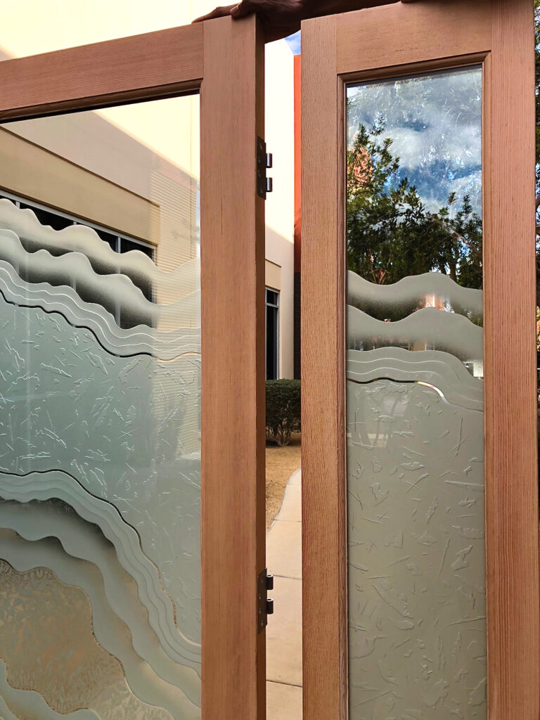 Close-up of contemporary frosted glass sidelight with Metamorphosis Peak pattern