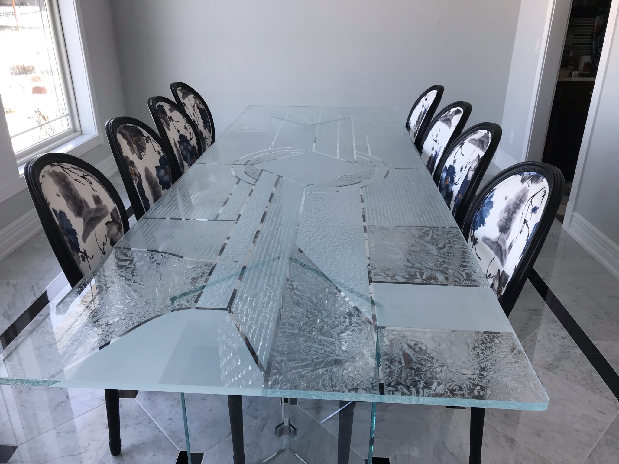 Tempered glass table adding style and strength to a modern kitchen interior
