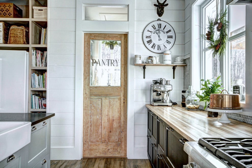 modern farmhouse design antique pantry door with glass panel 