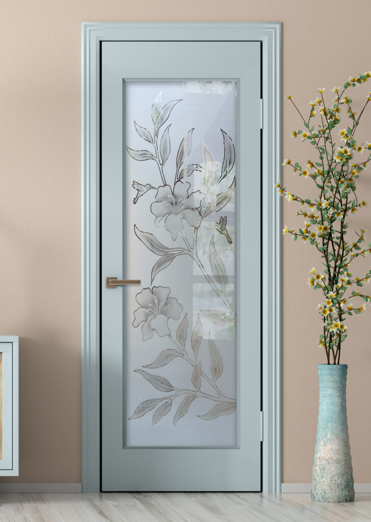 Light blue painted pantry door with frosted glass hibiscus and hummingbird design in soft neutral tones