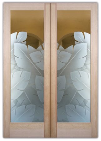 Interior Door featuring a Frosted Glass Tropical Design Sandblast Etched Glass Banana Leaves Design by Sans Soucie