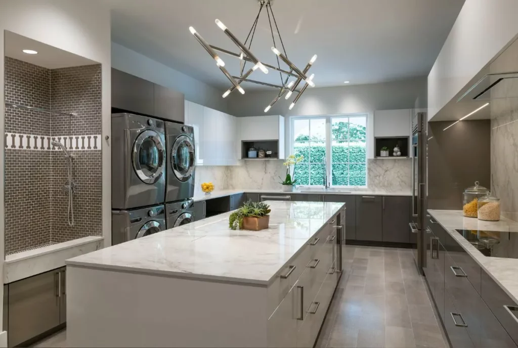 butler pantry with shower and laundry space along with large island for preparation butler's pantry modern design style