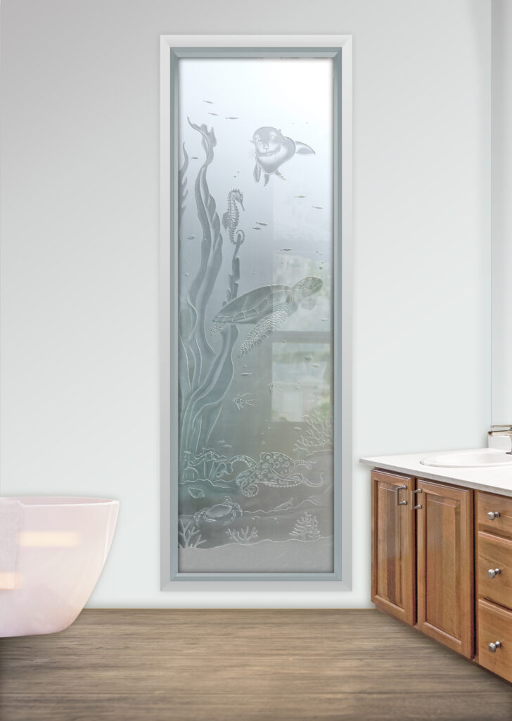 Etched glass wildlife scene window featuring sea life with sea turtle, fish, and coral in frosted and carved glass design for bathroom privacy
