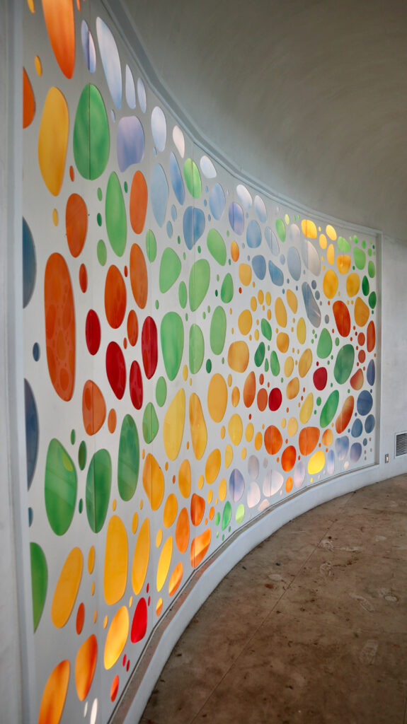 Vivid River Stones design carved glass wall.