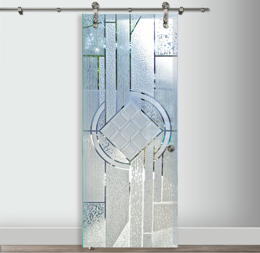 Modern frosted glass barn door with hand-carved geometric etched panels and a central diamond pattern, mounted on stainless steel sliding hardware against a neutral interior wall.
