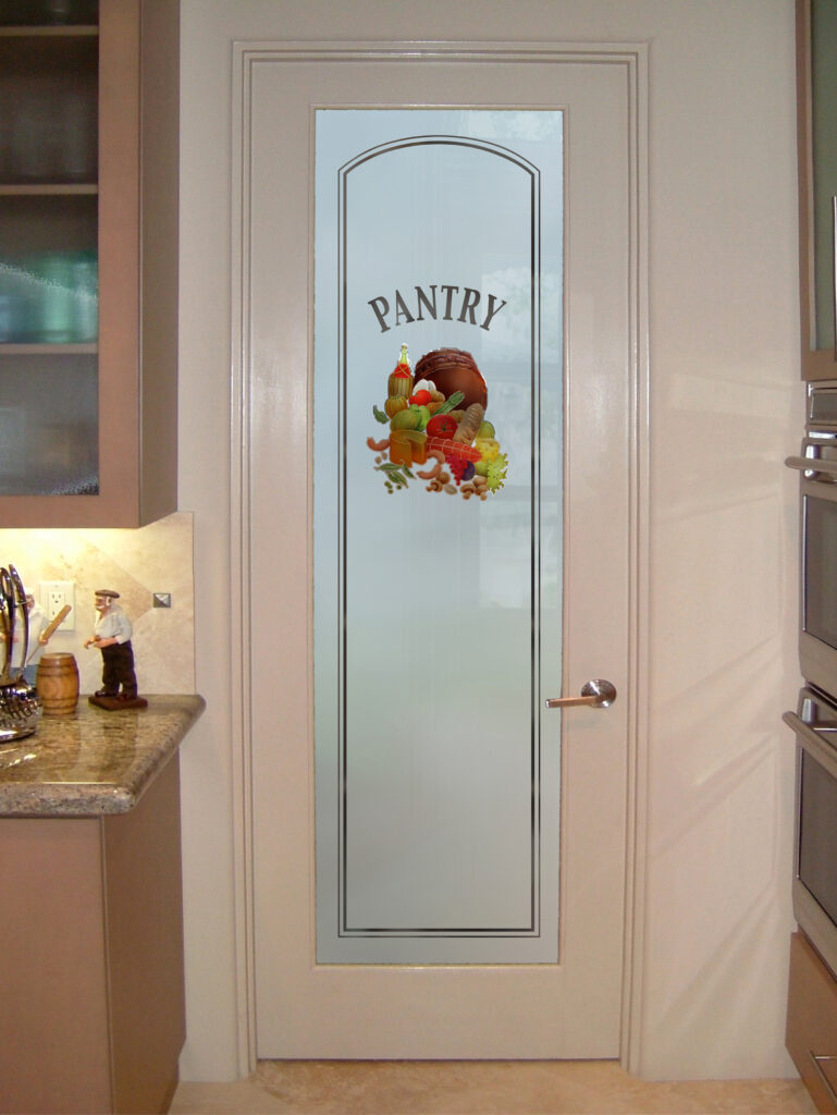 A perennial favorite pantry door idea featuring a frosted glass panel with a decorative 'PANTRY' design and a colorful graphic of food items, offering a stylish pantry door with glass for any kitchen style.