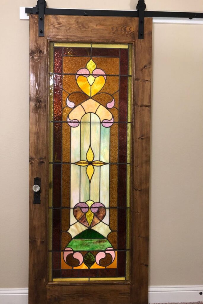 Sliding barn style door with stained glass