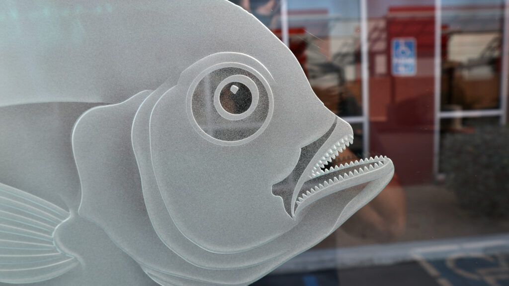 Carved fish detail in frosted glass