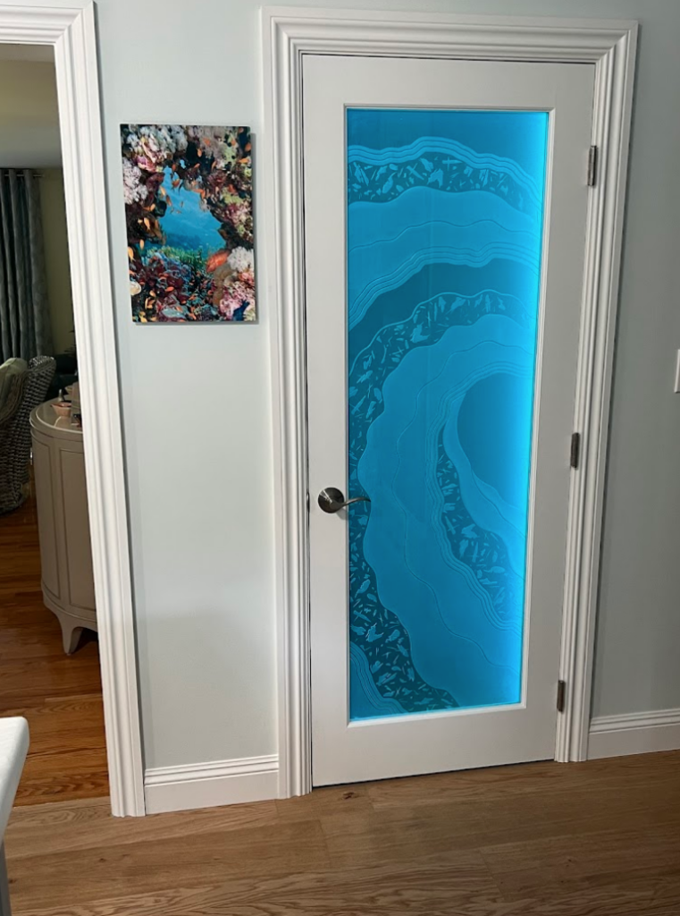 Etched glass entry door with layered wave-pattern frosted glass