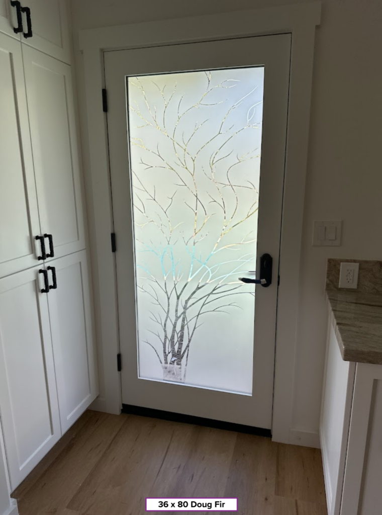 Interior view of the frosted glass door with 1D negative wispy tree design in morning light creating soft glow and subtle color reflections through glass