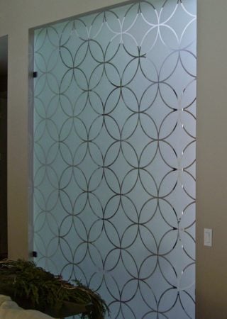 Partition featuring a Frosted Glass Geometric Design Sandblast Etched Glass Circles Intersecting Small Scale Design by Sans Soucie