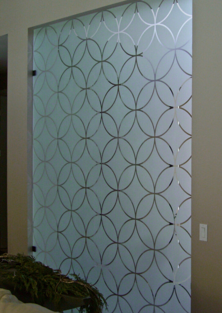 Etched glass panel with circles intersecting designs