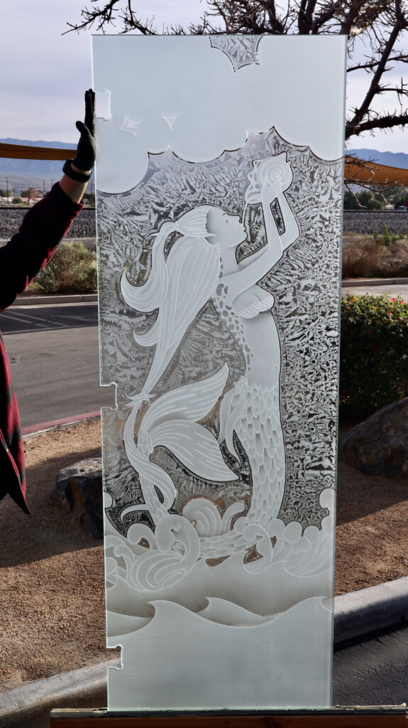 Mermaid glass partition panel featuring a detailed 3D Enhanced carved mermaid emerging from ocean waves, surrounded by textured frosted glass for privacy and artistic impact.