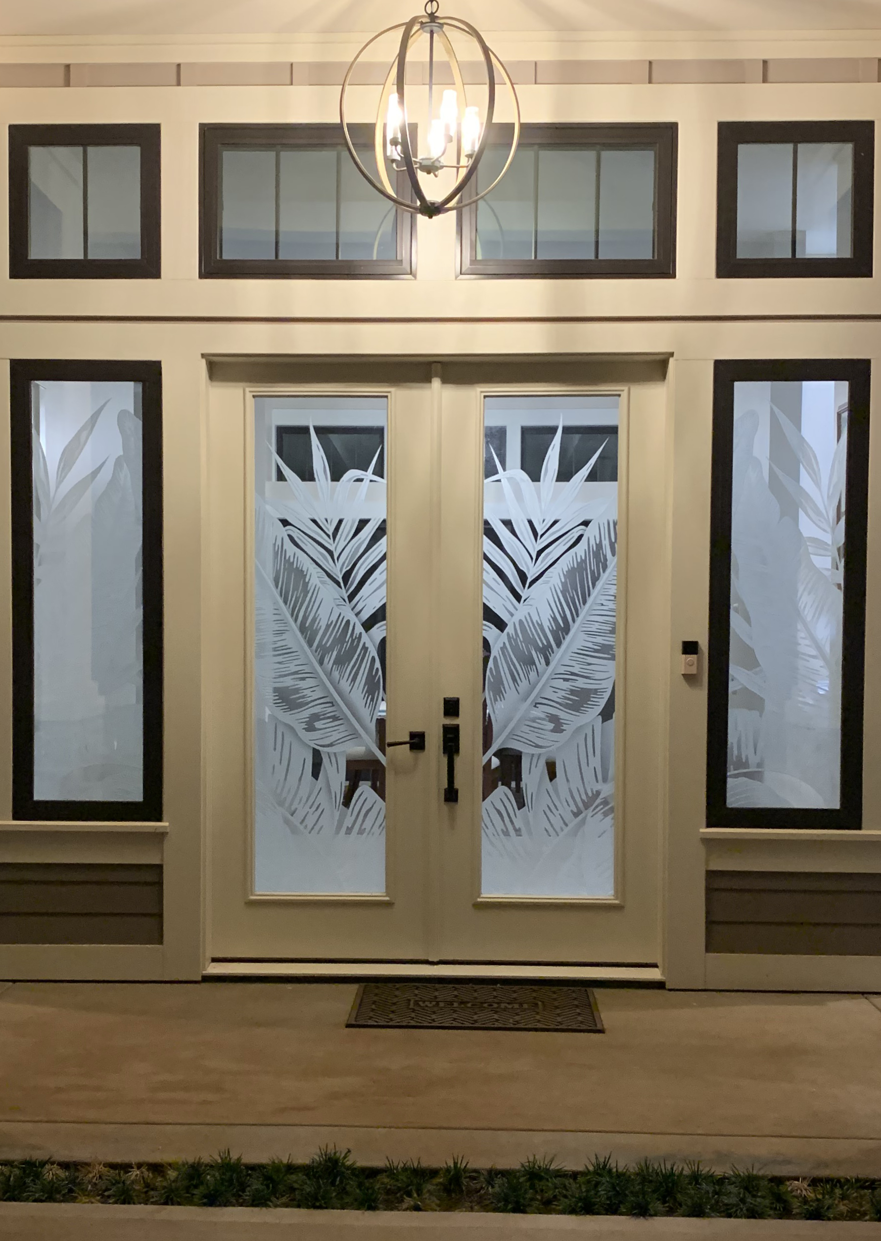 Entry doors with Bahama Leaves frosted glass design, stunning door art ideas for decorative glass doors and artistic entryways.