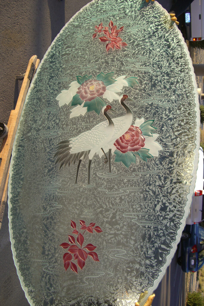 Carved and painted table top with a shoreline irregular edge