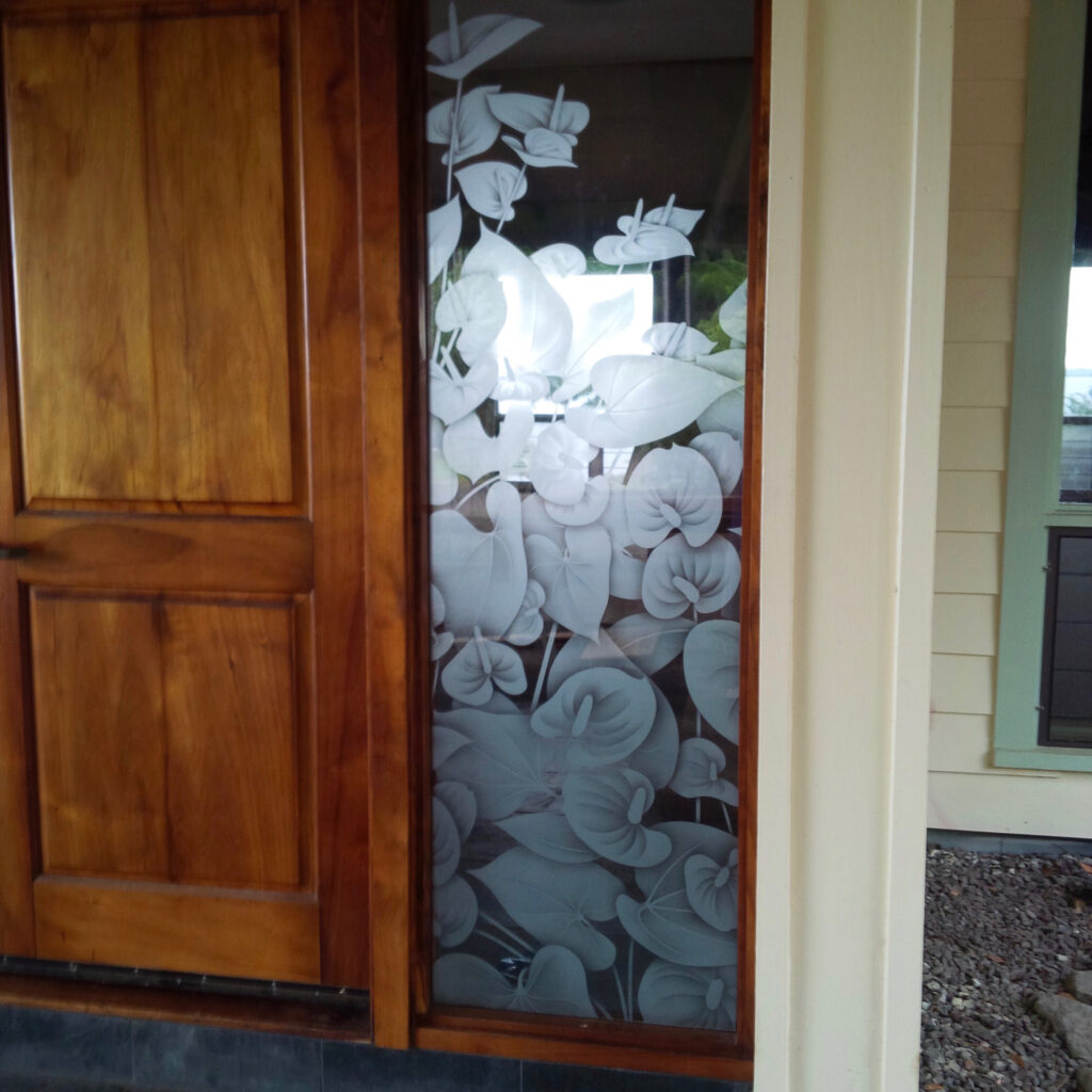 Decorative sidelights with etched and shaded Anthurium design
