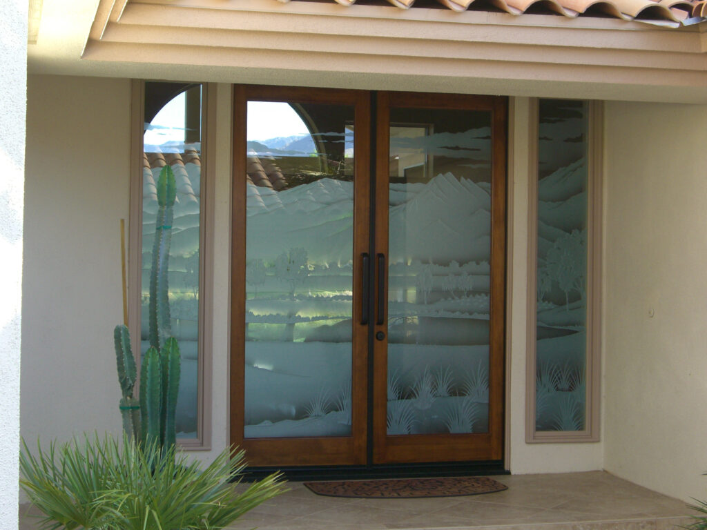 Double doors with desert mountains and cactus design