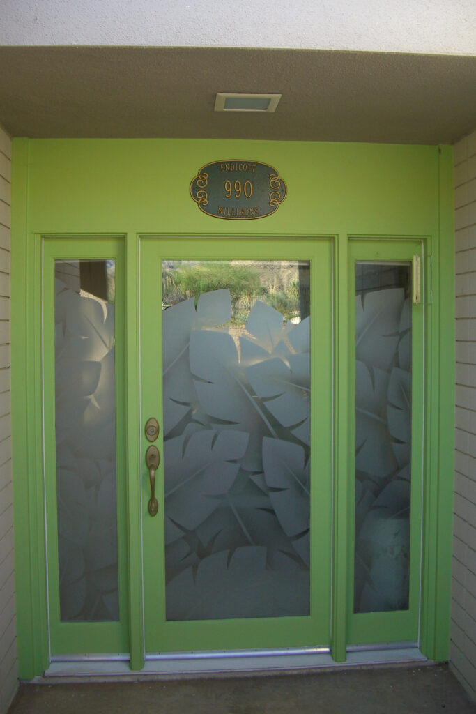 Frosted glass front door with tropical banana leaves design
