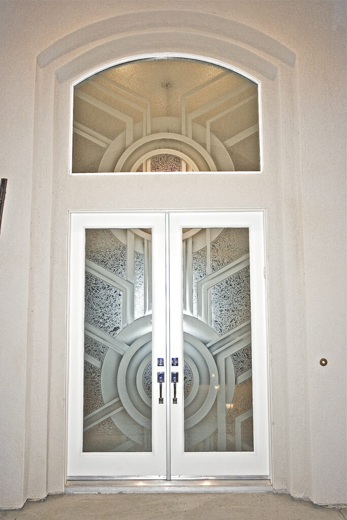 modern front entry doors with 3D carved glass geometric design and matching transom window above