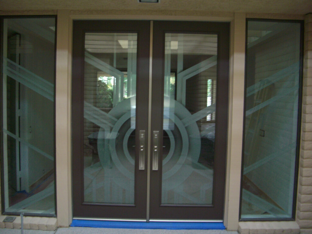 Modern exterior French doors with Sans Soucie Art Glass Sun Odyssey IV frosted glass design