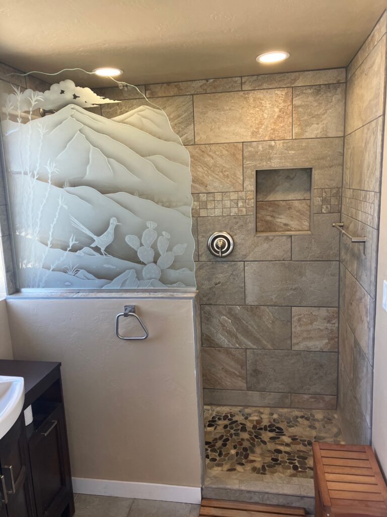 Residential glass partition wall with Ocotillo Roadrunner carved design