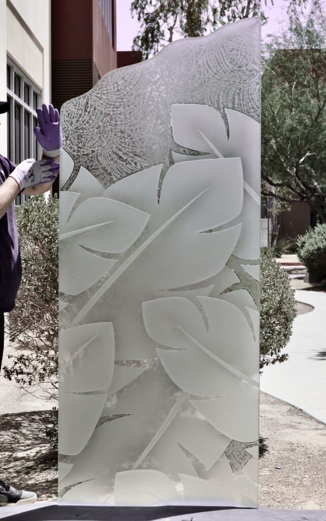 Stylish etched glass panel with banana leaves design