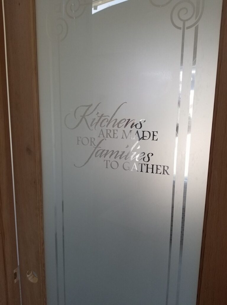 Frosted pantry door glass insert with ‘Kitchens are made for families to gather’ etched text