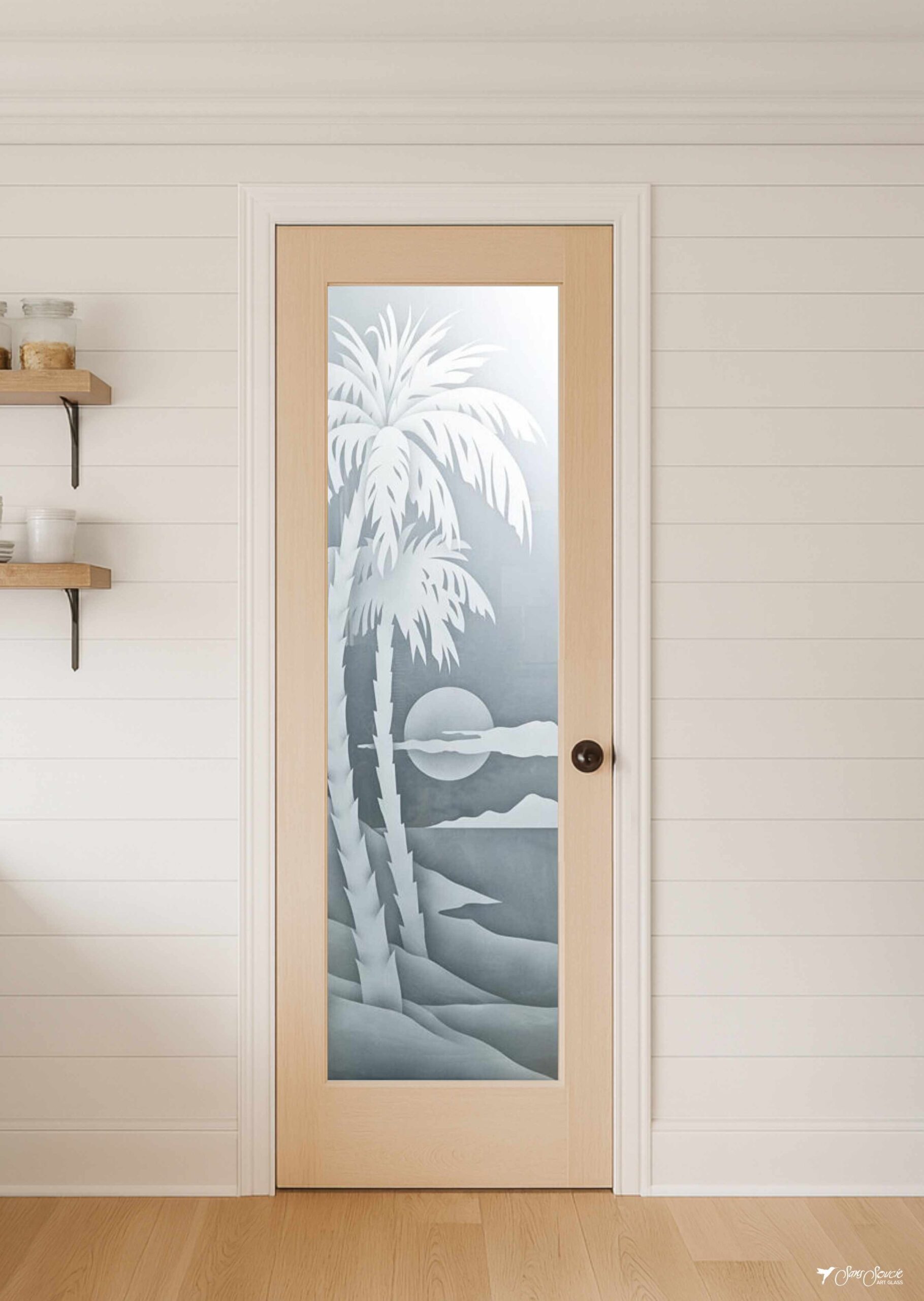 Farmhouse pantry door featuring the Palm Sunset frosted glass insert, framed in natural wood and showcasing artistic etched and/or painted details.
