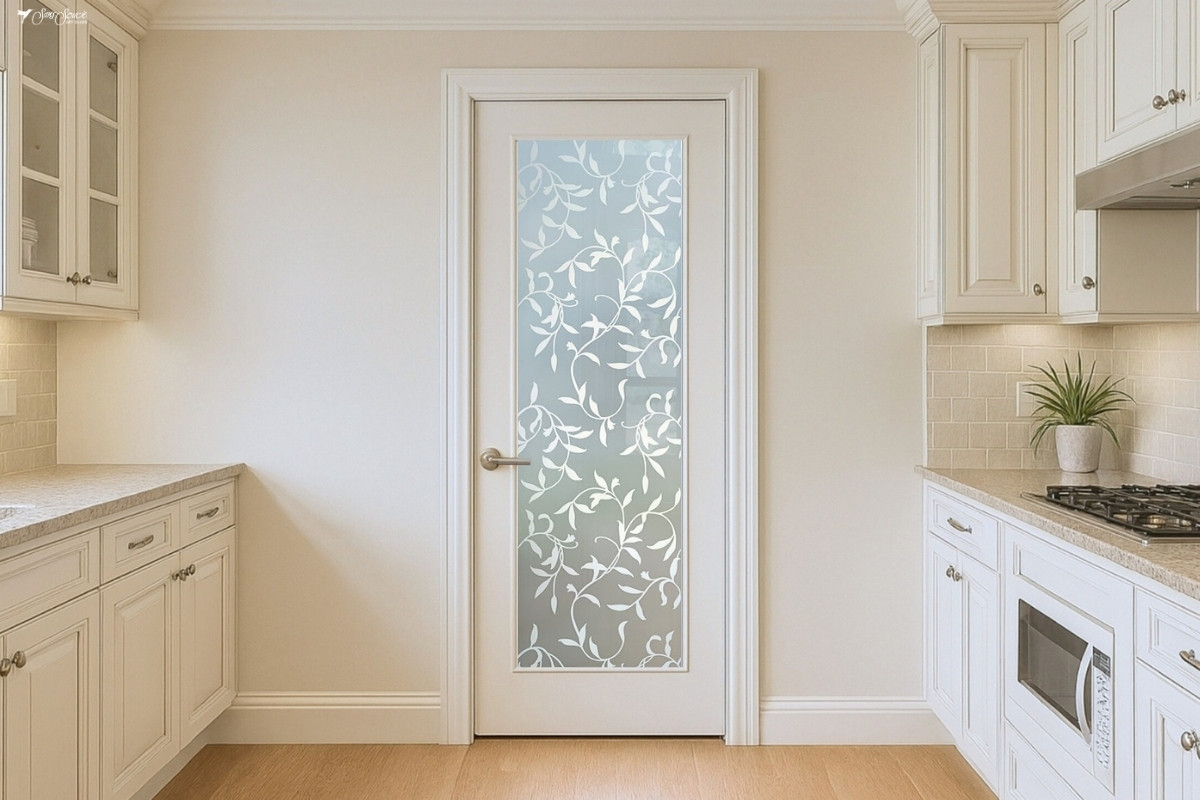 Farmhouse pantry door featuring the Vines frosted glass insert, framed in natural wood and showcasing artistic etched and/or painted details.