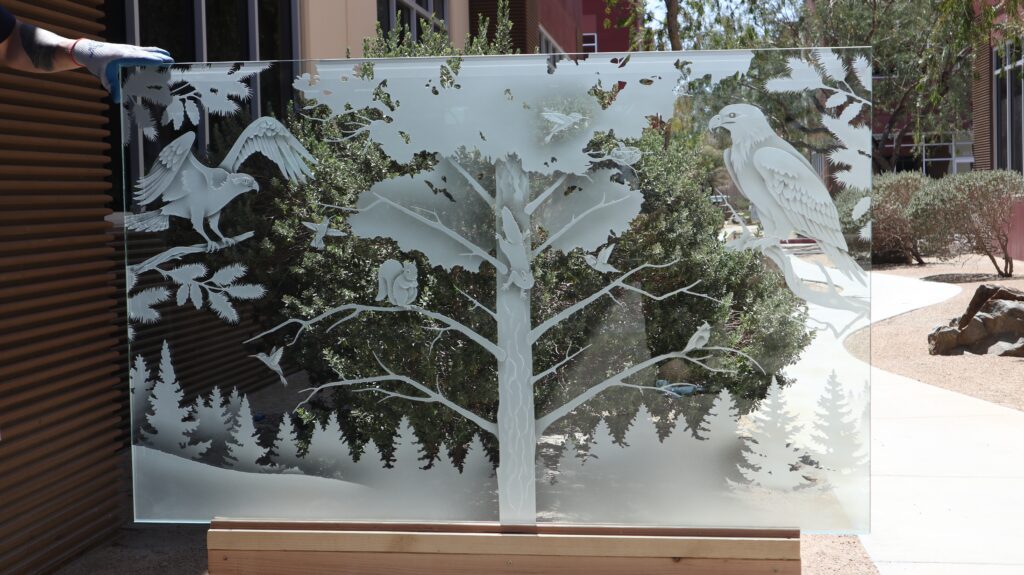 Woodland Scene glass partition panel featuring eagles, forest wildlife, and frosted nature-inspired artwork