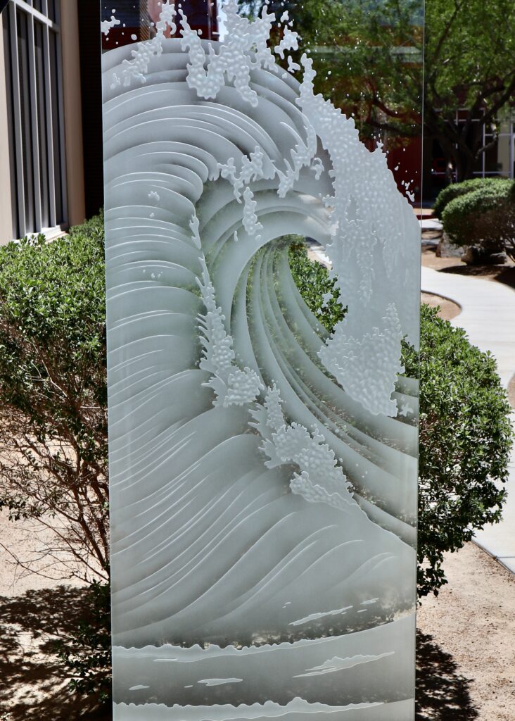 Etched glass panel with ocean wave-inspired design