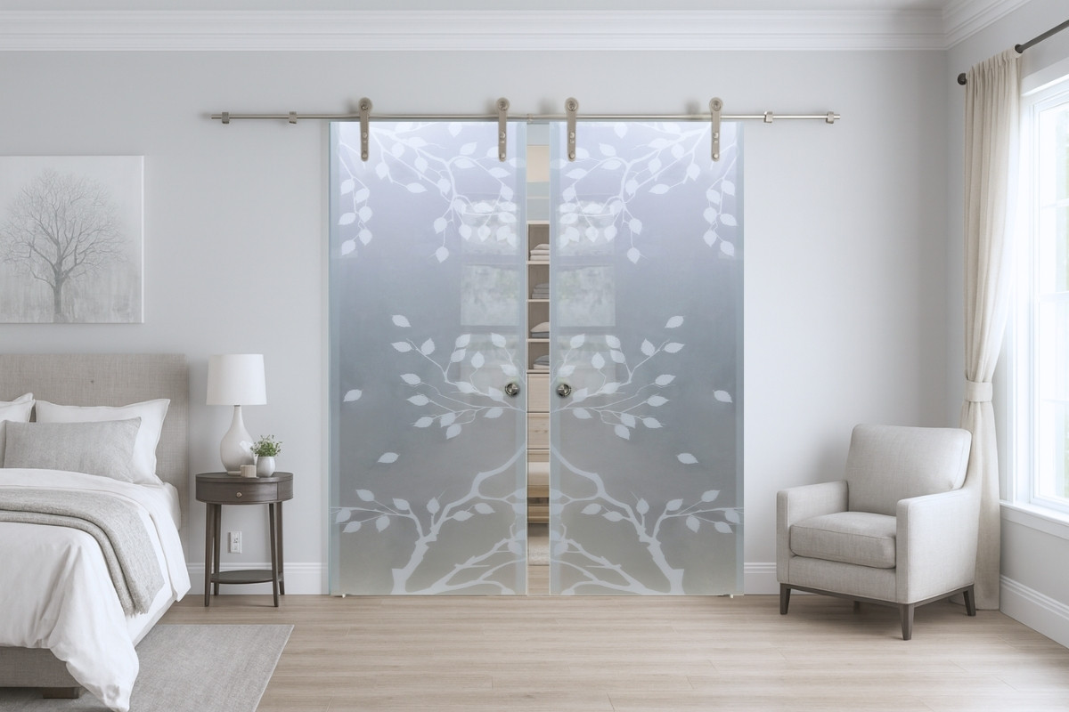 Decorative glass barn doors creating a stylish interior divider and space-saving feature.