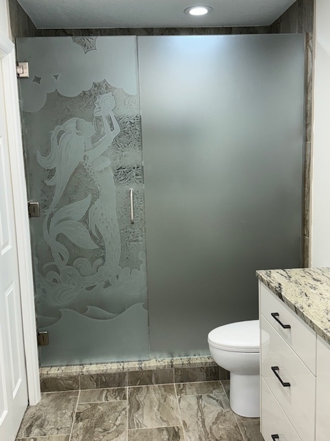 Modern frameless shower door with textured glass