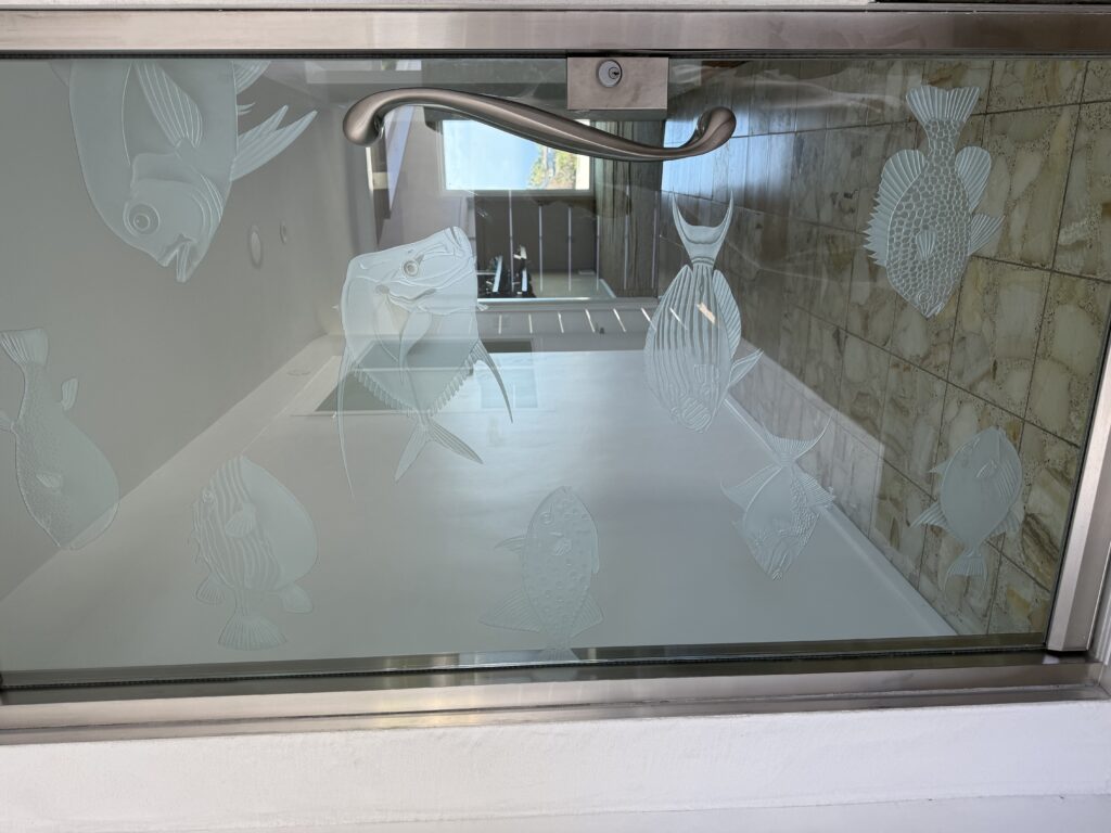 Etched glass door with branding elements