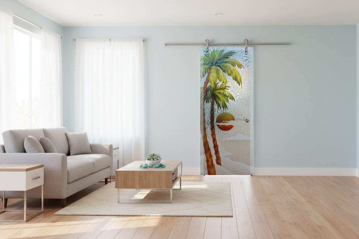 Painted frosted glass barn door with tropical design, custom-made by Sans Soucie Art Glass in a bright coastal living room.