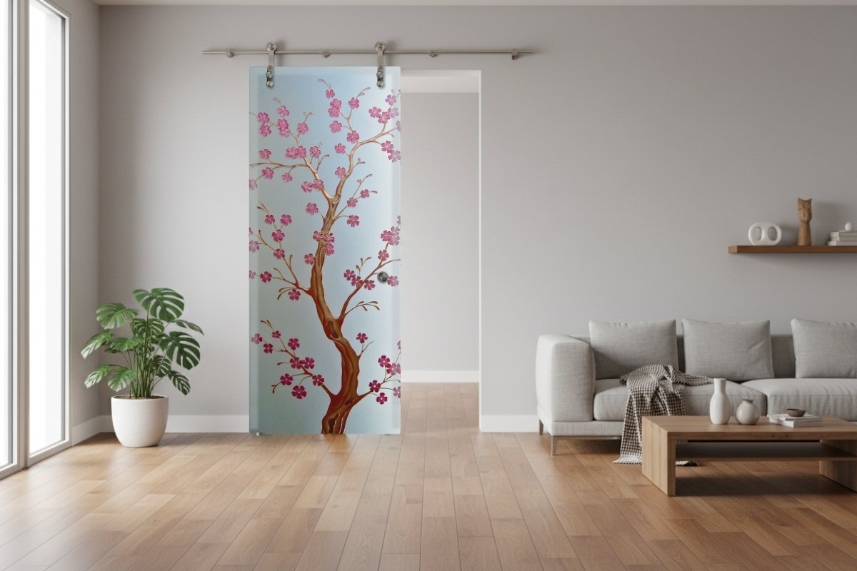 Cherry Blossom painted private glass barn door in a modern living room, custom-designed by Sans Soucie&rsquo;s glass barn door artisans.