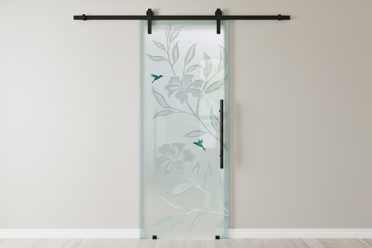 Etched glass barn door with modern nature design adding style to compact spaces
