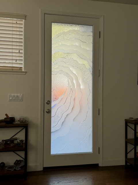 Contemporary Sans Soucie frosted glass door featuring a Metacurl carved and shaded design