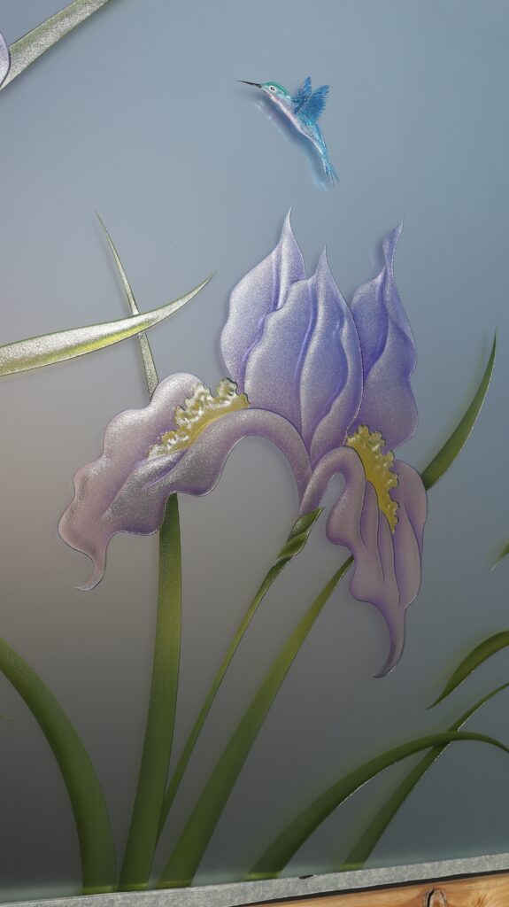Private frosted glass door featuring tropical iris flowers and hummingbird, deeply carved and hand painted in soft purple and green tones.
