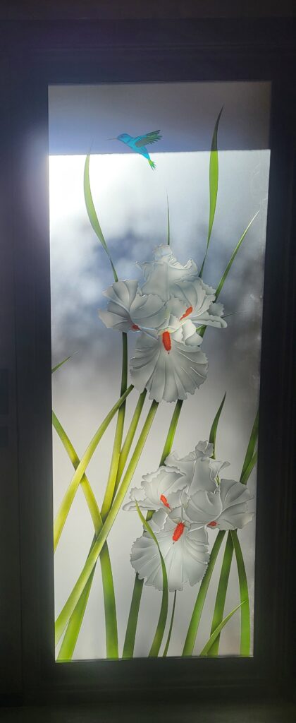 Frosted glass with a stunning decorative design, illuminated at night. 