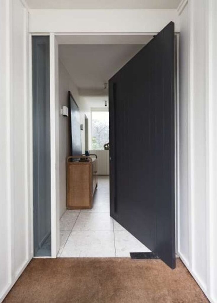 Oversized pivot entrance door