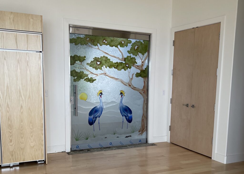 Frosted glass interior door with decorative design, painted African Crane and tree, combining art and privacy