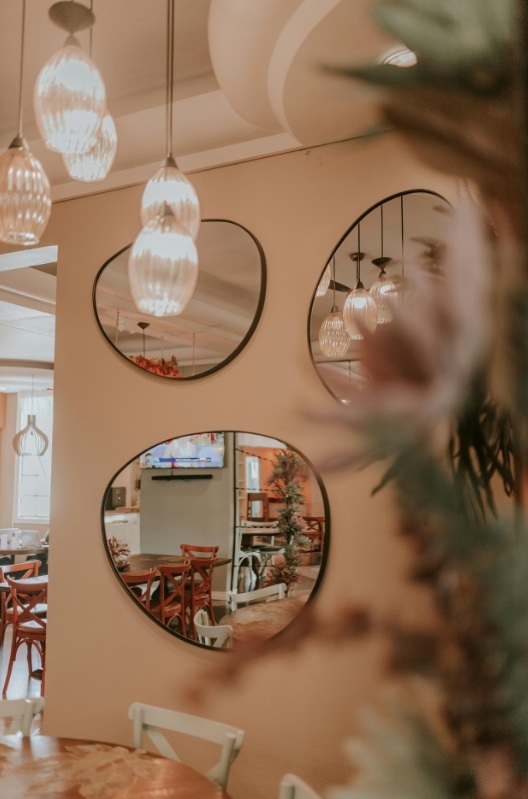 Mirrors hanging on the wall in a restaurant