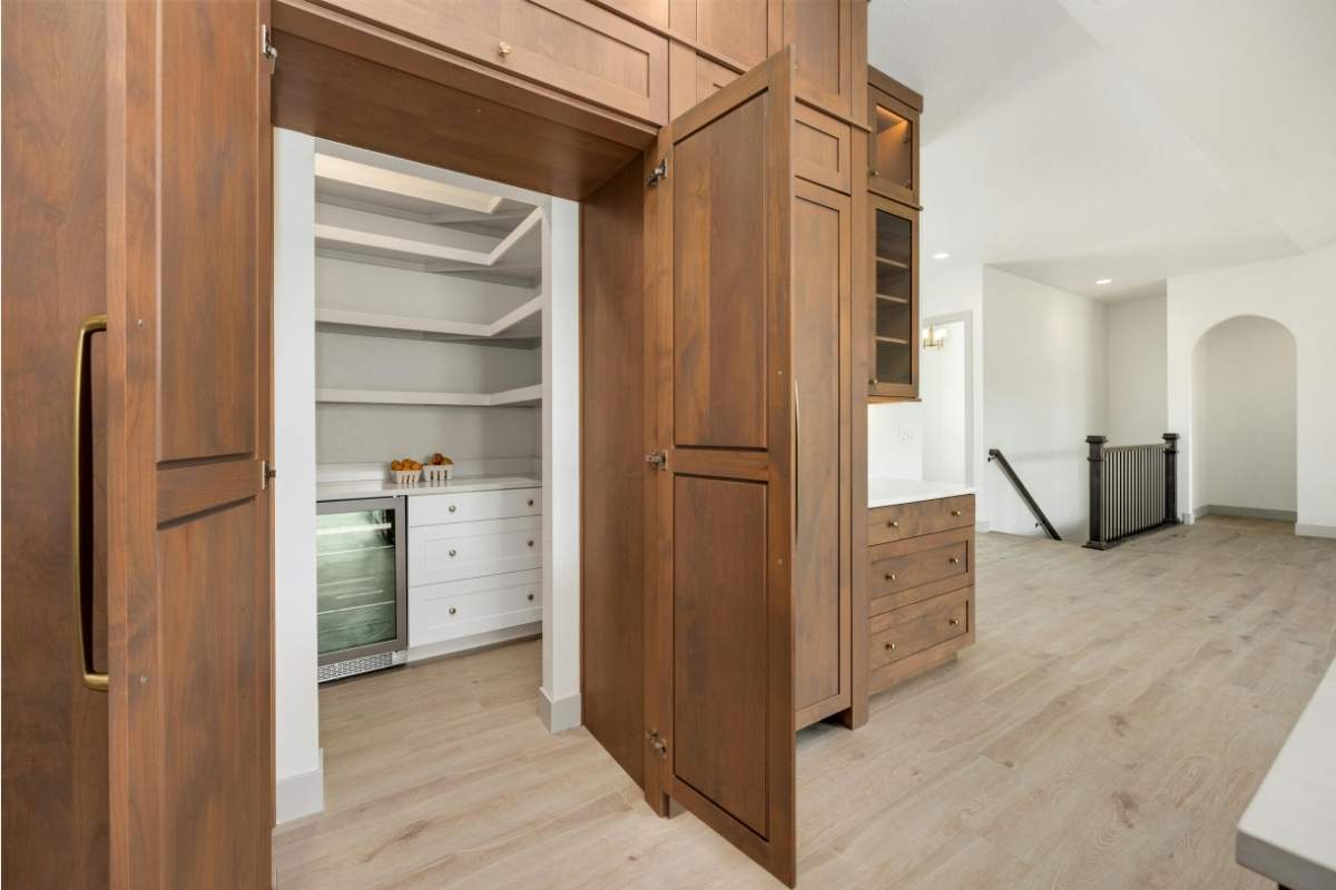 Pantry storage seamlessly integrated into the kitchen cabinets