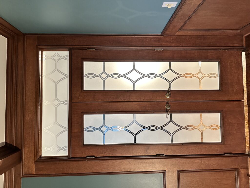 Diamond Beads frosted glass interior double doors with transom, featuring a 1D negative design, with lights on both in front and behind the glass, showcasing a bright white etched finish