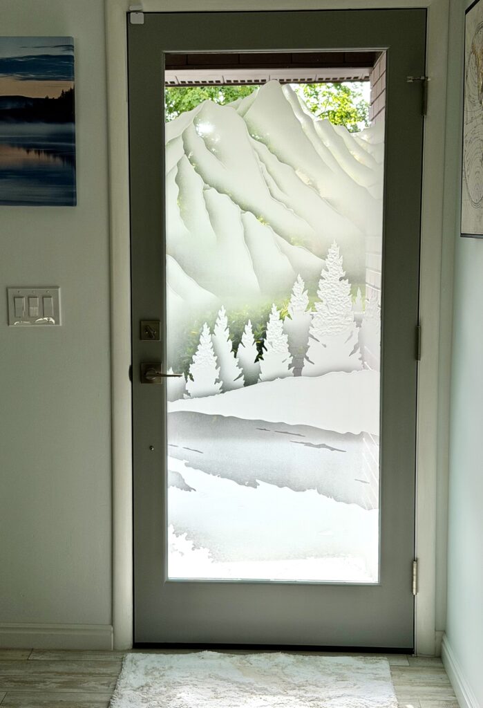 Semi-private glass front door with stunning landscape design