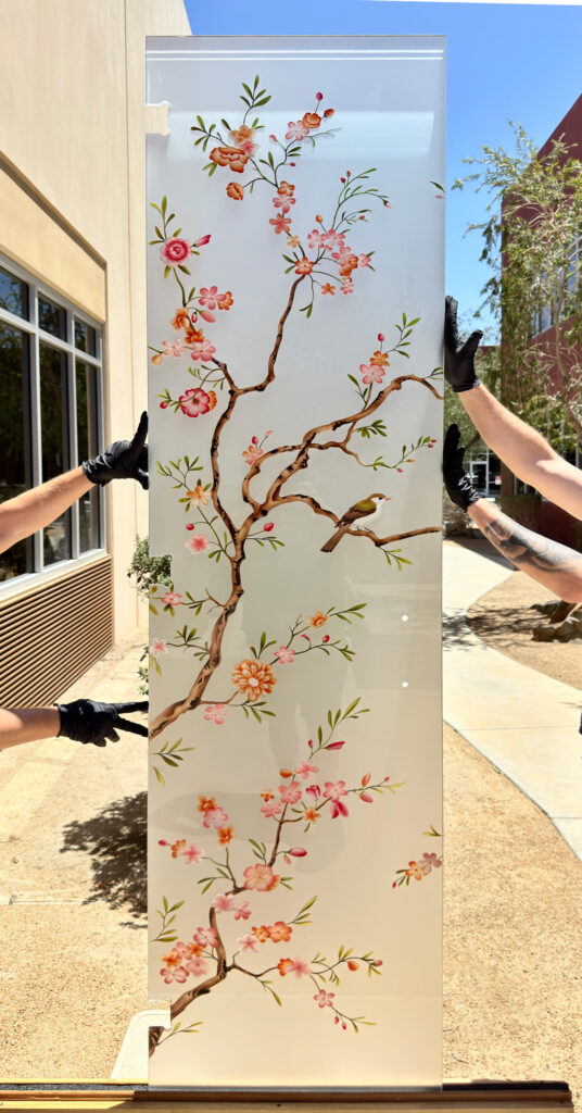 Songbird and blossom colored glass door panel with delicate branches, designed as front door decorative glass inserts for elegant entryways.