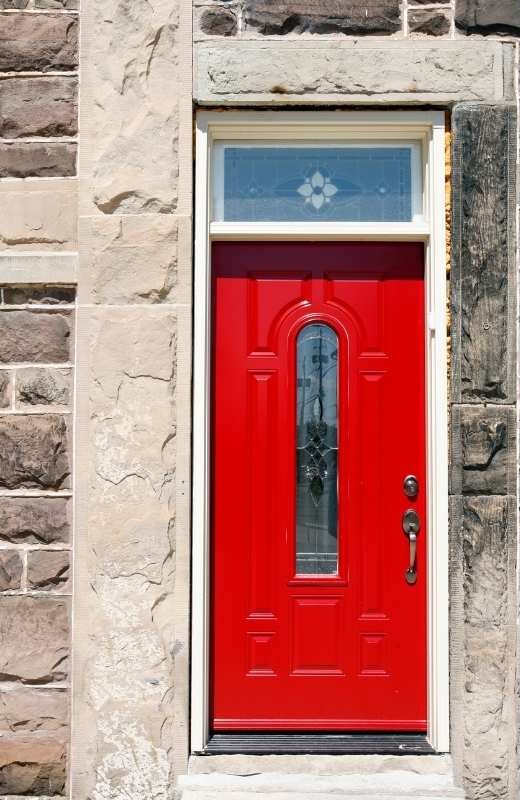 Modern wood front door with a narrow vertical decorative glass panel